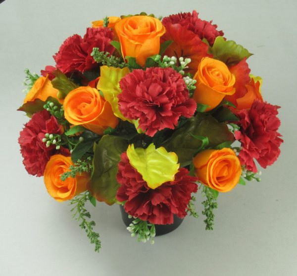 Grave flower arrangement with red large carnations and orange rose buds. - Image 3