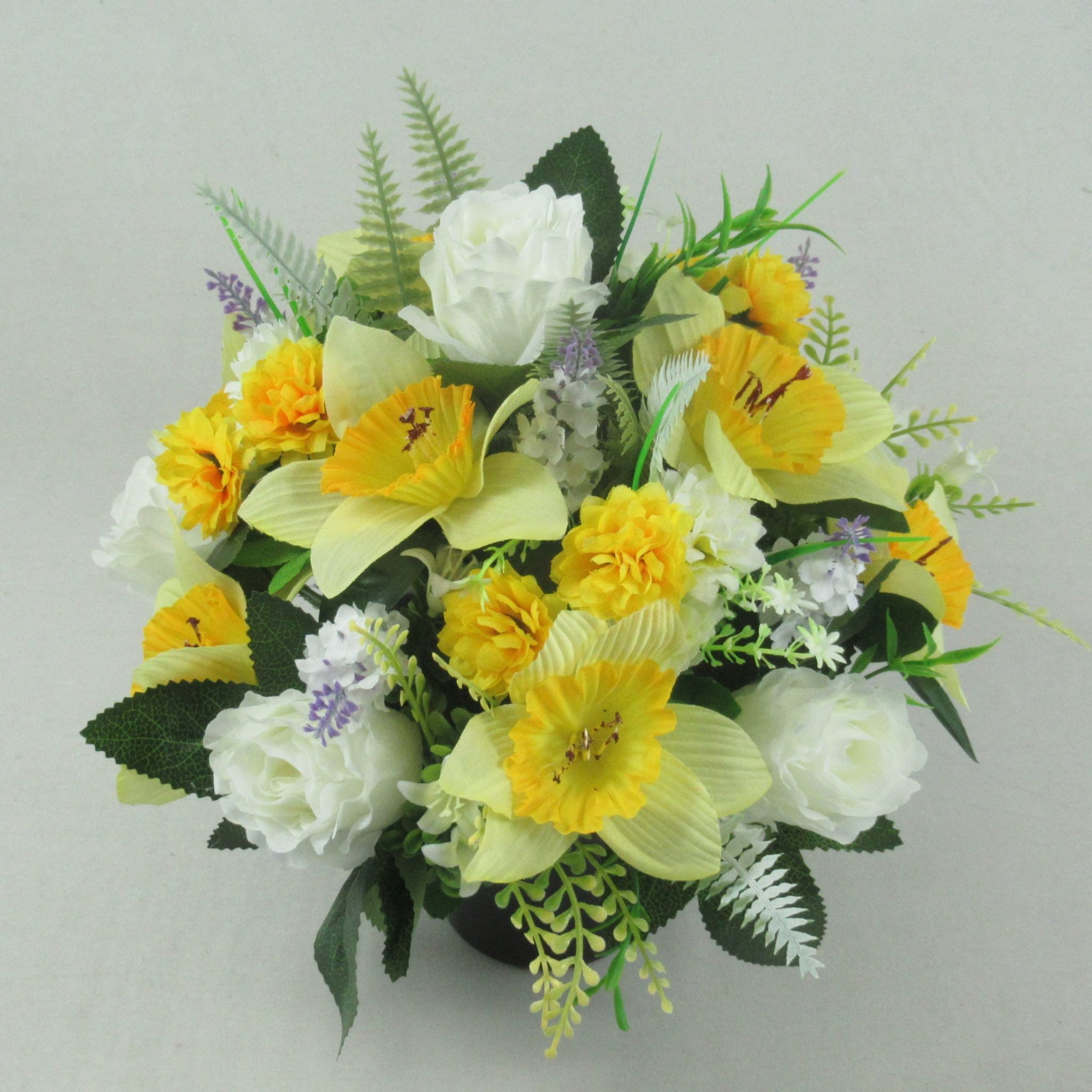 Grave flower arrangement with ivory crinkle roses and daffodils with